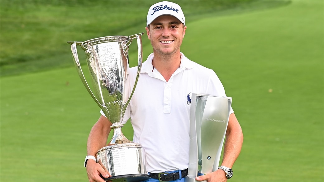 Justin Thomas raises the trophy in victory after winning the 2019 BMW Championship